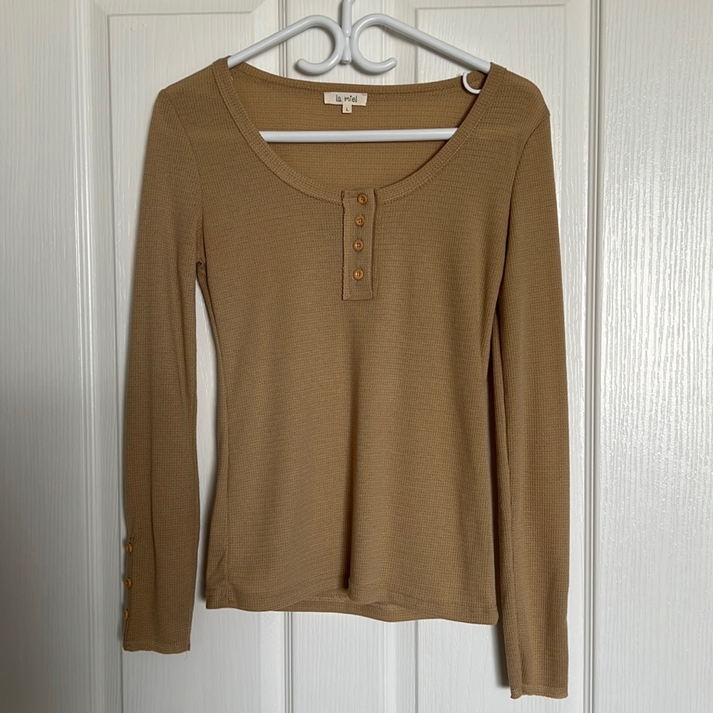 Long-sleeve with faux buttons. NWOT